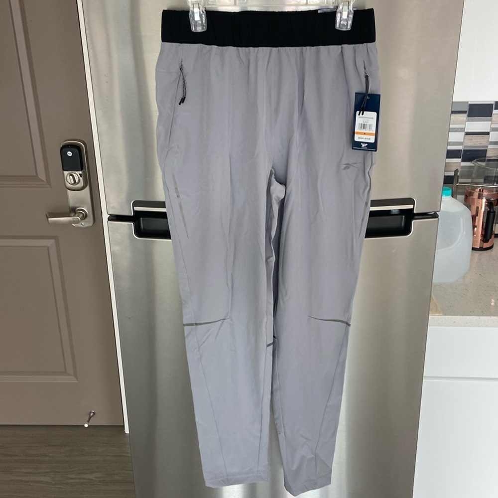 Brand new Reebok athletic pants - men’s medium